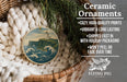 Ceramic ornaments, featuring a lighthouse on a cliff, are displayed in a basket with a wicker frame.