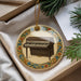 A decorative ornament featuring a piano on a white background, surrounded by a colorful border.