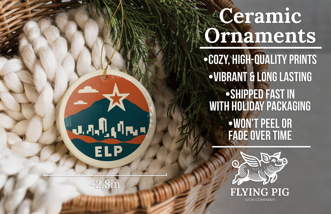 Ceramic ornaments, featuring a ceramic ornament with a cityscape design and a star, hanging from a wicker basket.