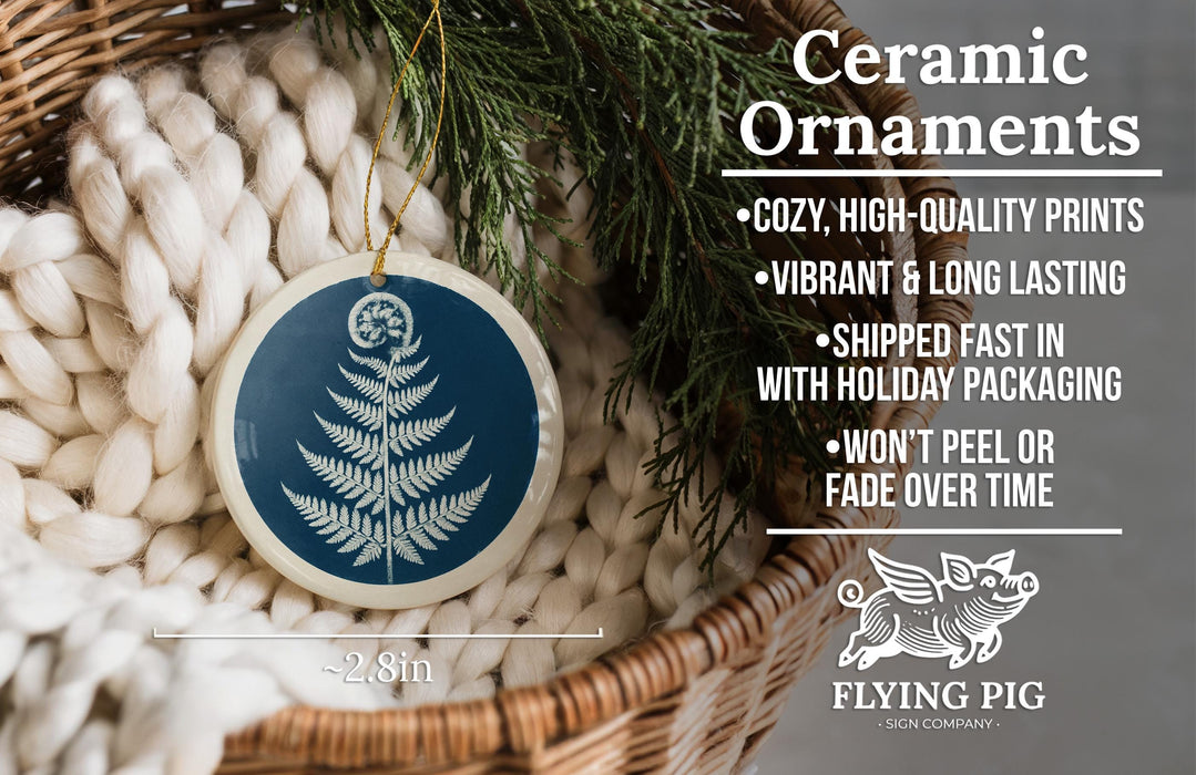 Ceramic ornaments, featuring a blue tree design, are displayed in a woven basket.