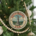 A round ornament on a Christmas tree, featuring the text "GETTYSBURG USA" and an illustration of the Liberty Bell.