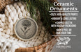 Ceramic ornaments, including a round ornament with a flower design, are displayed in a basket with a pine branch.