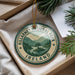 A circular ornament with the text "KILLARNEY NATIONAL PARK IRELAND" and a scenic landscape of mountains and a lake.