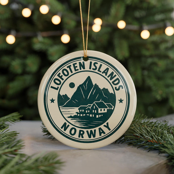 A circular ornament with the text "Lofoten Islands NORWAY" and a mountain silhouette, hanging from a string.
