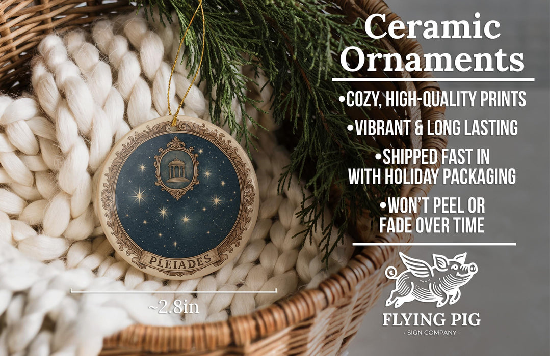 Ceramic ornaments, including a round ornament with a starry night sky design and the word "Pleiades", are displayed in a wicker basket.