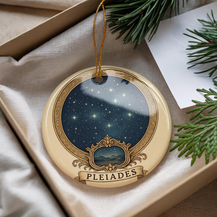A decorative ornament with a starry night sky design and the word "PLEIADES" on it, hanging from a string.