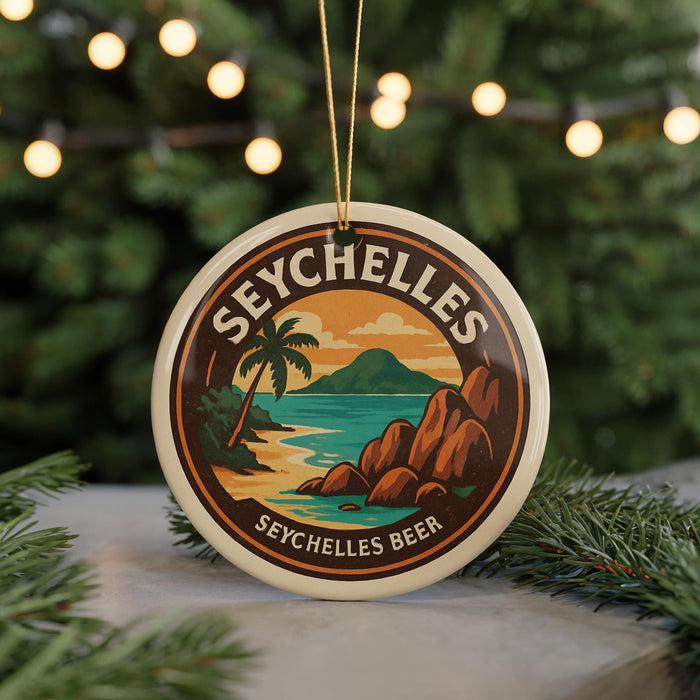 A round ornament with the text "SEYCHELLES" and an illustration of a tropical beach scene, along with the text "SEYCHELLES BEER" below it.