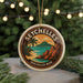 A round ornament with the text "SEYCHELLES" and an illustration of a tropical beach scene, along with the text "SEYCHELLES BEER" below it.