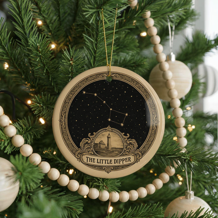 A Christmas tree decorated with ornaments, including a circular ornament with a starry night sky design and the text "The Little Dipper" below it.