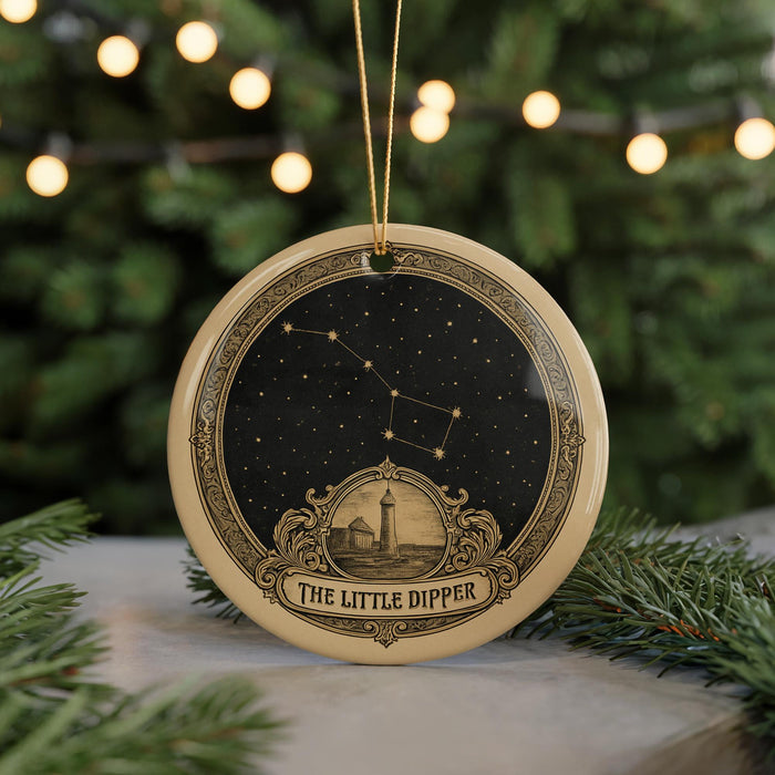 A decorative ornament featuring a starry night sky and a lighthouse, with the text "The Little Dipper" below the image.