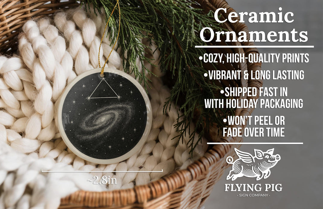Ceramic ornaments, including a ceramic ornament with a galaxy design, are displayed in a wicker basket.