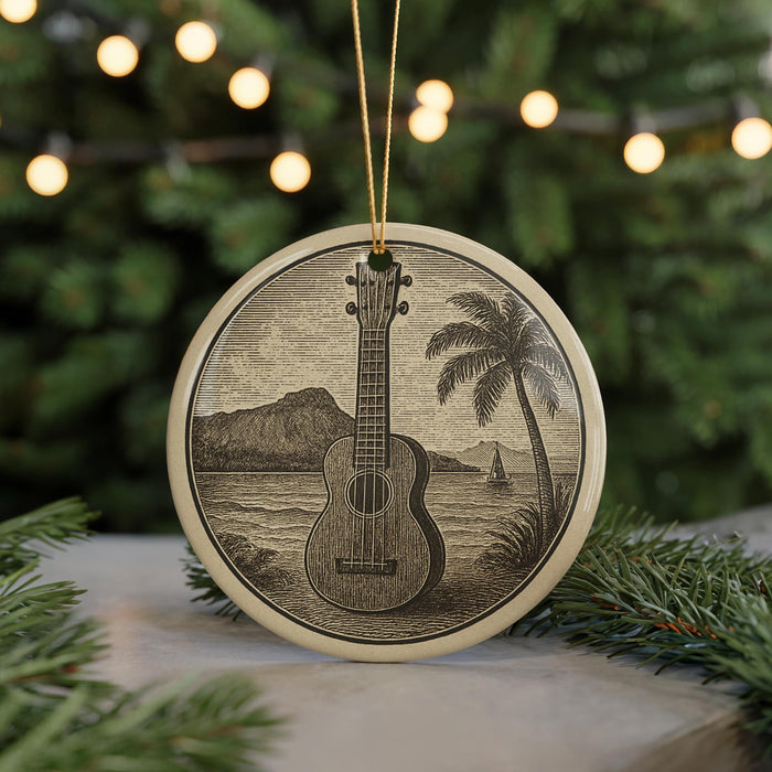 A circular ornament featuring a guitar and a tropical landscape, with palm trees and a body of water in the background, is displayed in front of a blurred Christmas tree with lights.