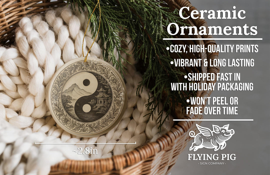Ceramic ornaments, a ceramic ornament with a yin and yang symbol, are displayed in a woven basket.
