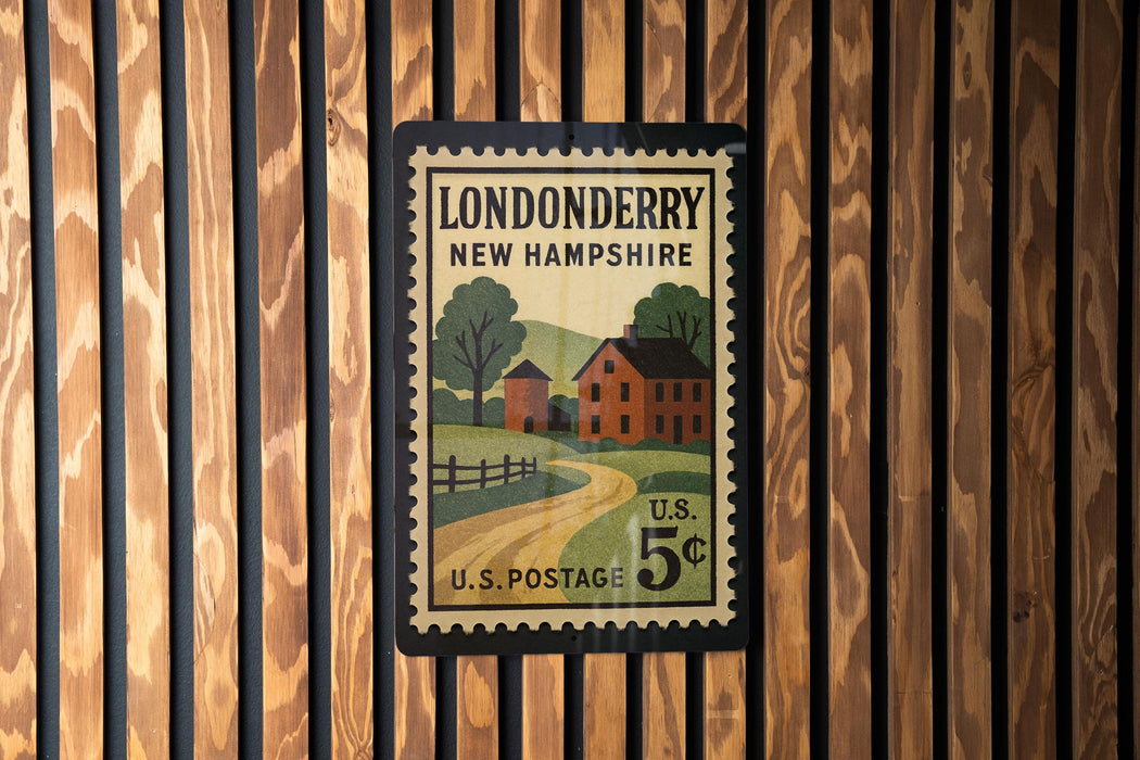 A vintage postage stamp from New Hampshire, featuring a rural scene with a house, road, and trees.