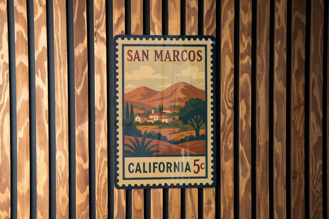 A framed poster of San Marcos, California, with a vintage-style illustration of a rural landscape and mountains.