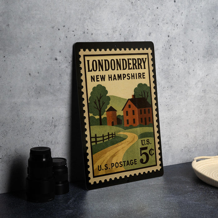 A vintage postage stamp from the United States, featuring a rural scene with a house and a road, displayed on a table.