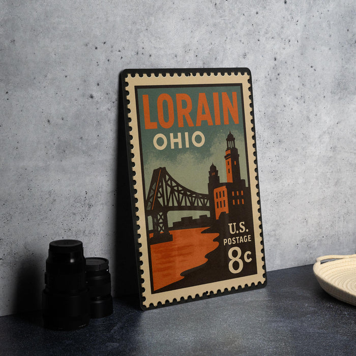 A vintage-style postage stamp from the United States, featuring an illustration of the Lorain, Ohio bridge.
