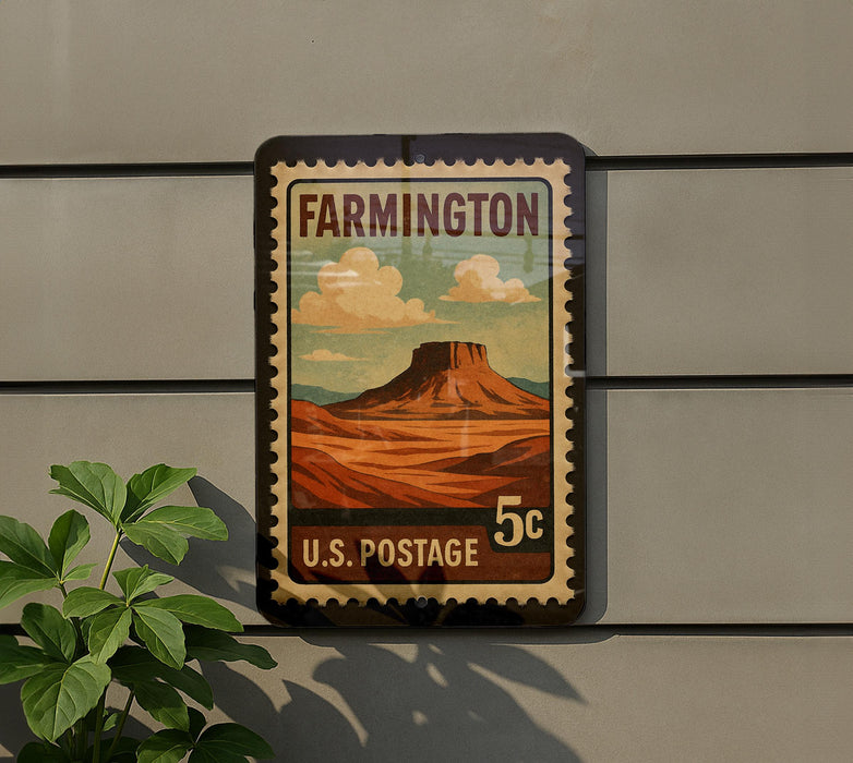A vintage-style postage stamp from the United States, featuring a desert landscape with a mountain in the background.