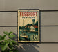 A vintage-style metal sign with a sailboat and a water tower, mounted on a wall.