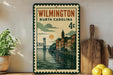 A vintage-style metal sign with a cityscape and a bridge, featuring the text "WILMINGTON NORTH CAROLINA 4c" and a postage stamp design.