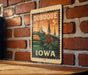 A vintage postage stamp from Dubuque, Iowa, featuring an illustration of the city's landmarks and a bridge.