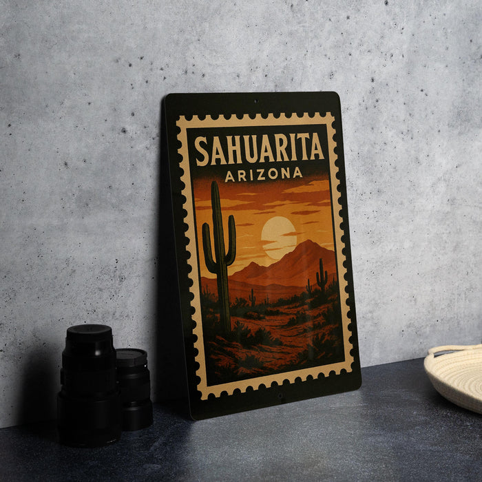 A framed poster of a desert landscape with a cactus and mountains, featuring the text "SAHUARITA ARIZONA" in the center.