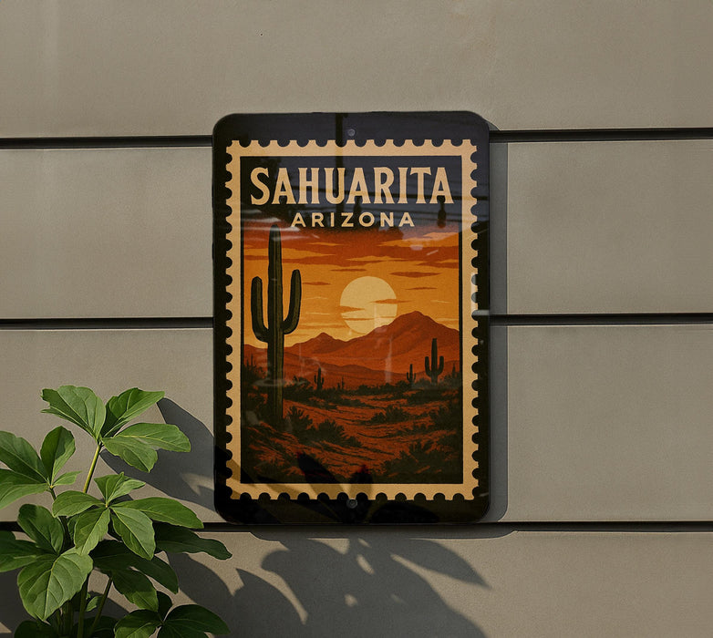 A framed poster of a desert landscape with a cactus and mountains in the background, mounted on a wall.