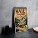A metal sign with a mountain landscape and a cabin, featuring the text "Vail, Colorado" and the denomination "4c".