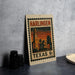 A vintage postage stamp from Harlingen, Texas, featuring a cityscape with a clock tower and palm trees, placed on a table next to some black camera lenses.