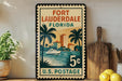 A vintage-style postage stamp from the United States Postal Service, featuring a tropical beach scene with palm trees, a boat, and buildings.