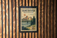 A postage stamp from the United States of America, featuring a cityscape and a bridge, is displayed on a wooden wall.