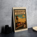 A vintage postage stamp from Arkansas featuring a water tower and a city street scene.
