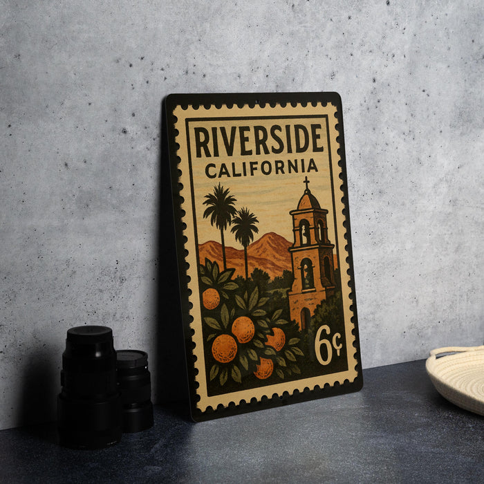 A vintage-style postage stamp from Riverside, California, featuring a bell tower and palm trees, with the text "RIVERSIDE CALIFORNIA" and the denomination "6¢".