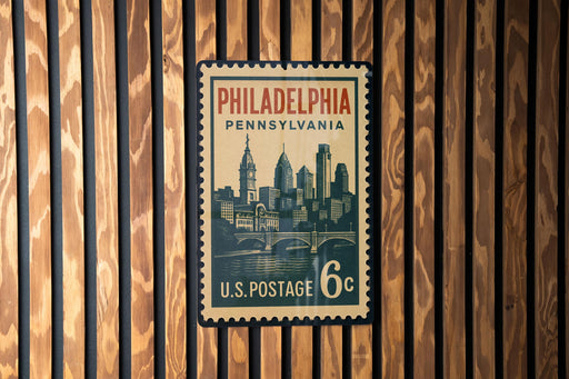 A vintage U.S. postage stamp from Philadelphia, Pennsylvania, featuring a cityscape and a bridge.