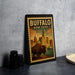 A framed poster of Buffalo, New York, featuring an illustration of a buffalo in the foreground with a cityscape in the background.