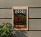 A vintage-style sign with the text "OGDEN UTAH" is displayed on a wall, featuring a mountain landscape and buildings.