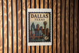 A vintage-style postage stamp from Dallas, Texas, featuring the city's skyline and a bridge.