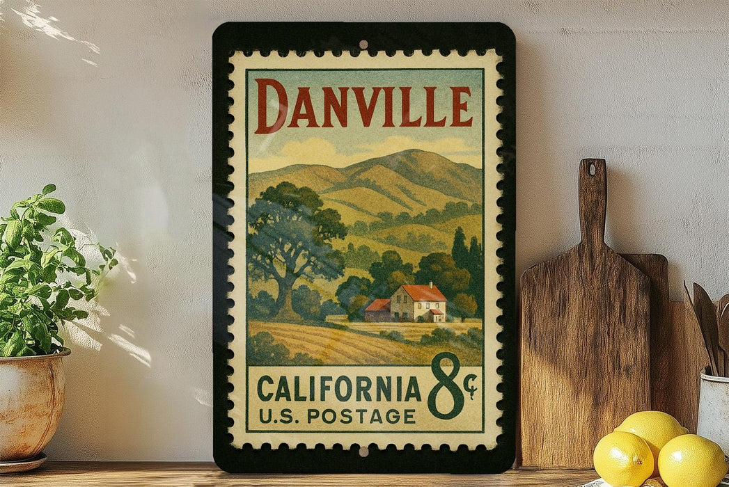 A framed vintage postage stamp depicting a rural landscape in California, with a house and trees in the background.
