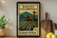 A framed vintage-style stamp depicting a rural landscape with a barn, windmill, and fields, along with the text "RANCHO CUCAMONGA CALIFORNIA".