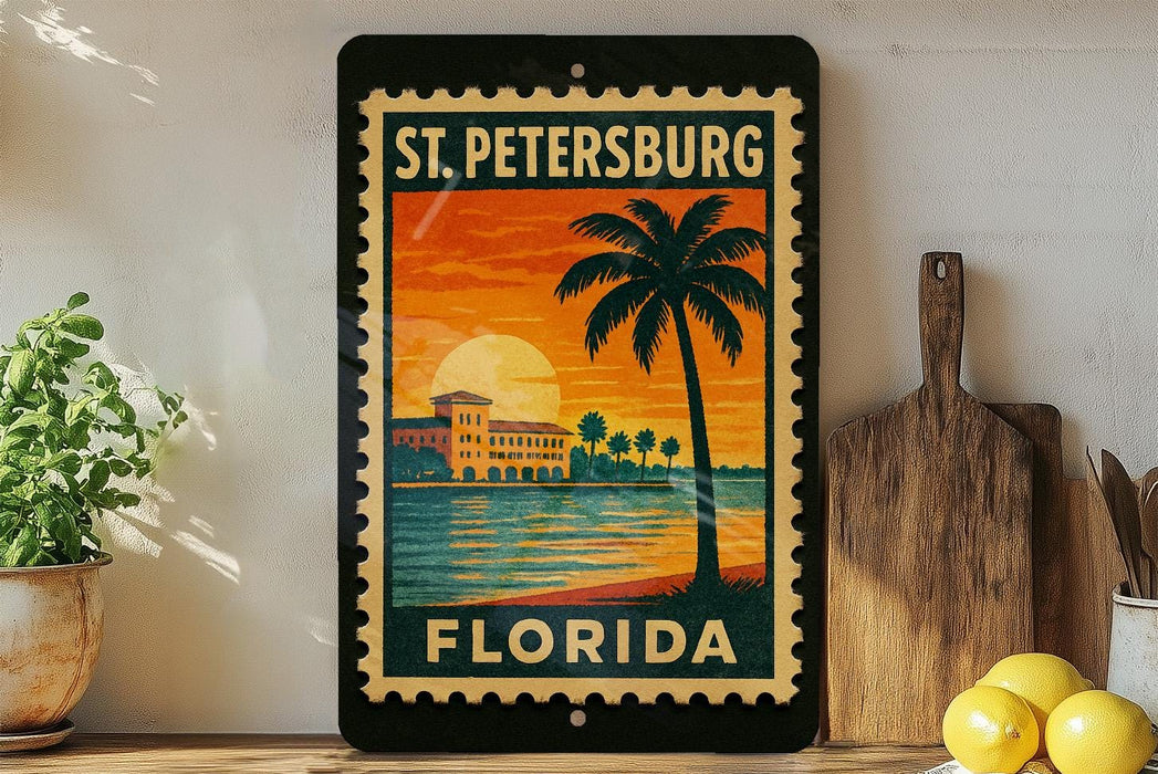 A framed vintage-style stamp depicting St. Petersburg, Florida, with a palm tree and sunset in the background.