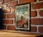 A vintage-style metal stamp depicting the Washington, D.C. District of Columbia, with a building and a clock tower, mounted on a brick wall.