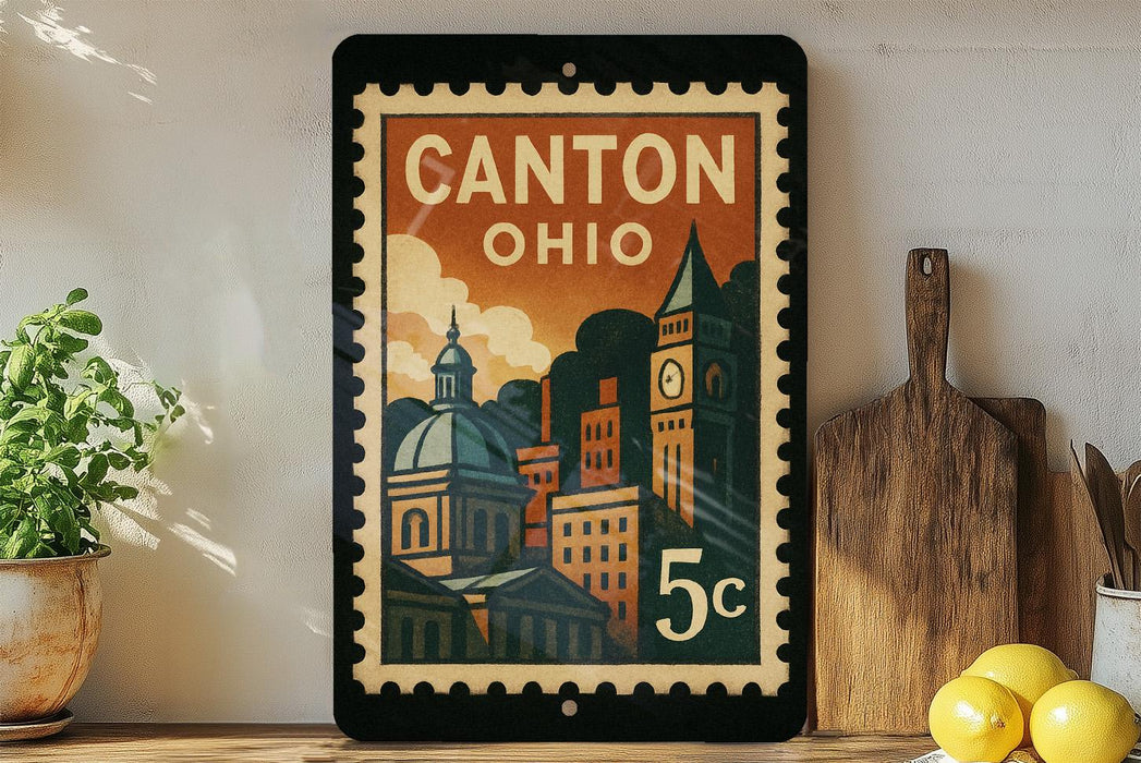 A vintage-style postage stamp from Canton, Ohio, featuring an illustration of the city's skyline and buildings.