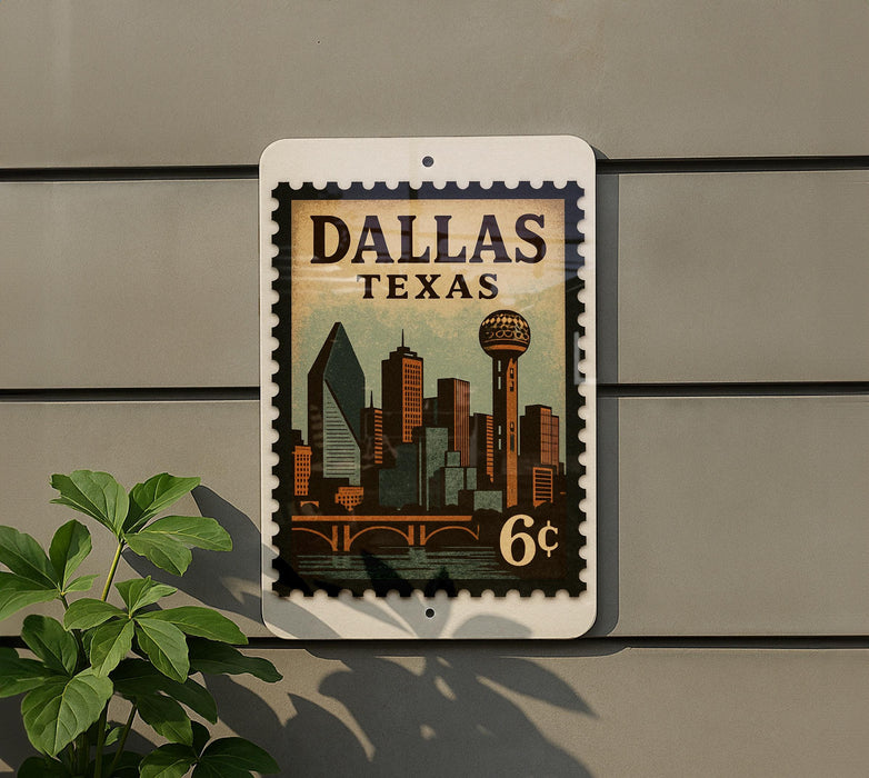 A postage stamp-like sign displaying the city of Dallas, Texas, with a skyline and a bridge.