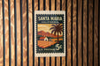 A U.S. postage stamp from Santa Maria, California, featuring a palm tree and a rural landscape.