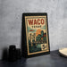 A framed poster of Waco, Texas, featuring a bridge and sunset, is displayed on a table.