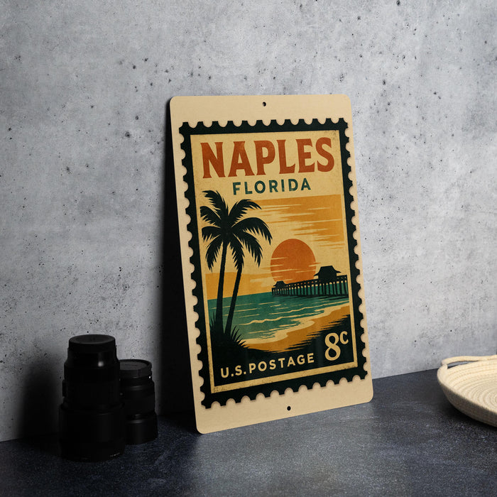 A vintage-style postage stamp from Florida, featuring a palm tree and sunset, is displayed on a table.