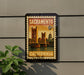 A framed postage stamp depicting the Golden Gate Bridge in Sacramento, California, with the text "SACRAMENTO 6c" and "CALIFORNIA" printed on it.