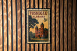 A 5 cent Alabama postage stamp featuring a building with a tree in the foreground.