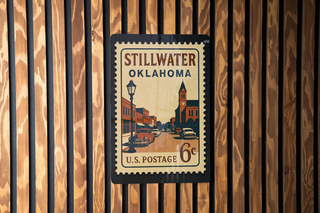 A vintage U.S. postage stamp from Stillwater, Oklahoma, featuring a street scene and a lamppost.