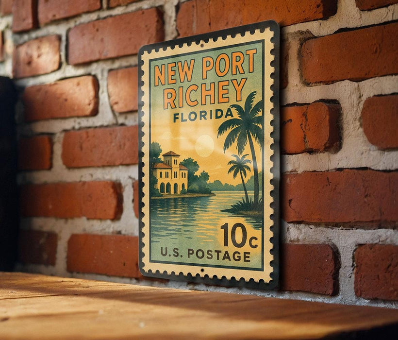 A vintage-style postage stamp from New Port Richey, Florida, featuring a palm tree and a building, is displayed on a brick wall.